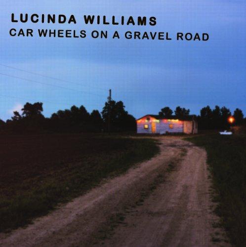 CAR WHEELS ON A GRAVEL ROAD (HOL)